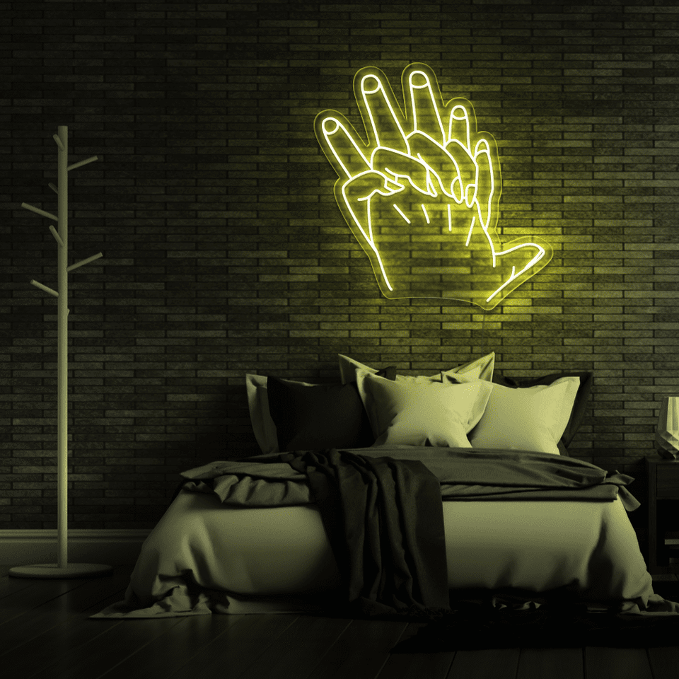 Holding Hands LED neon sign in lemon yellow color by Neon Marvels