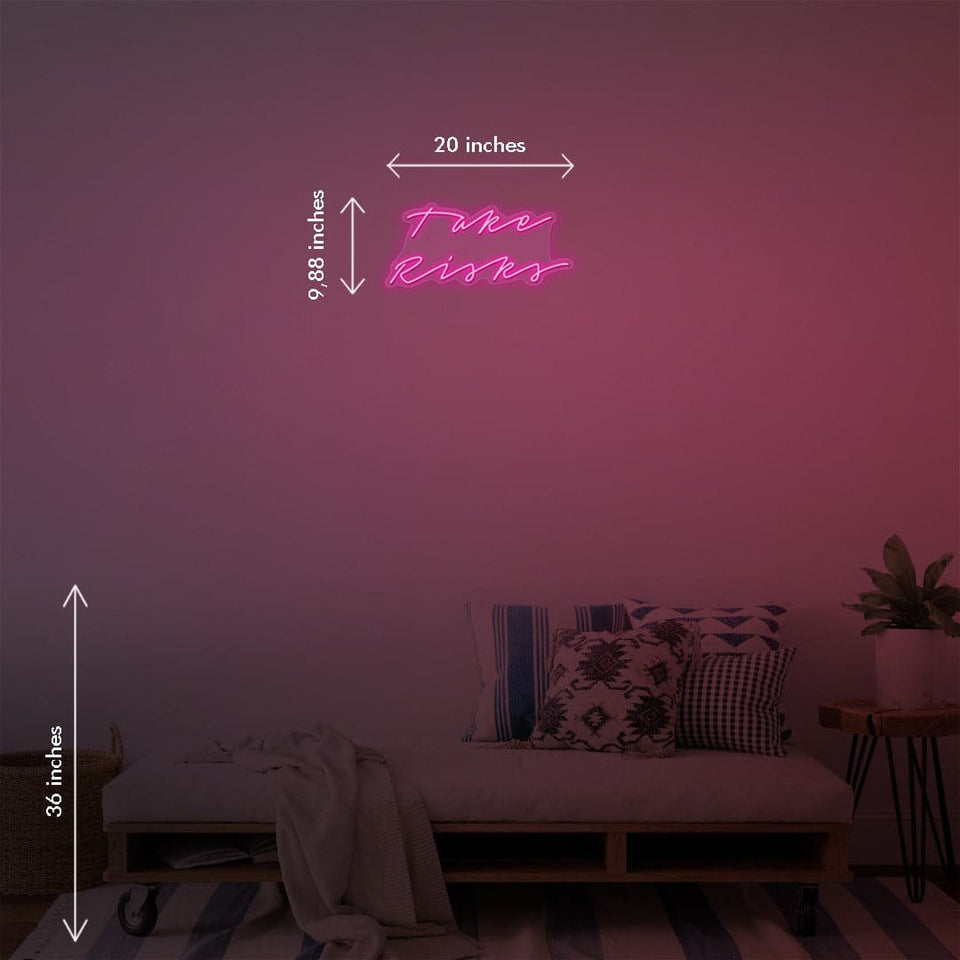 'Take Risks' is a 20 inch LED Neon Sign by Katie Zamprioli