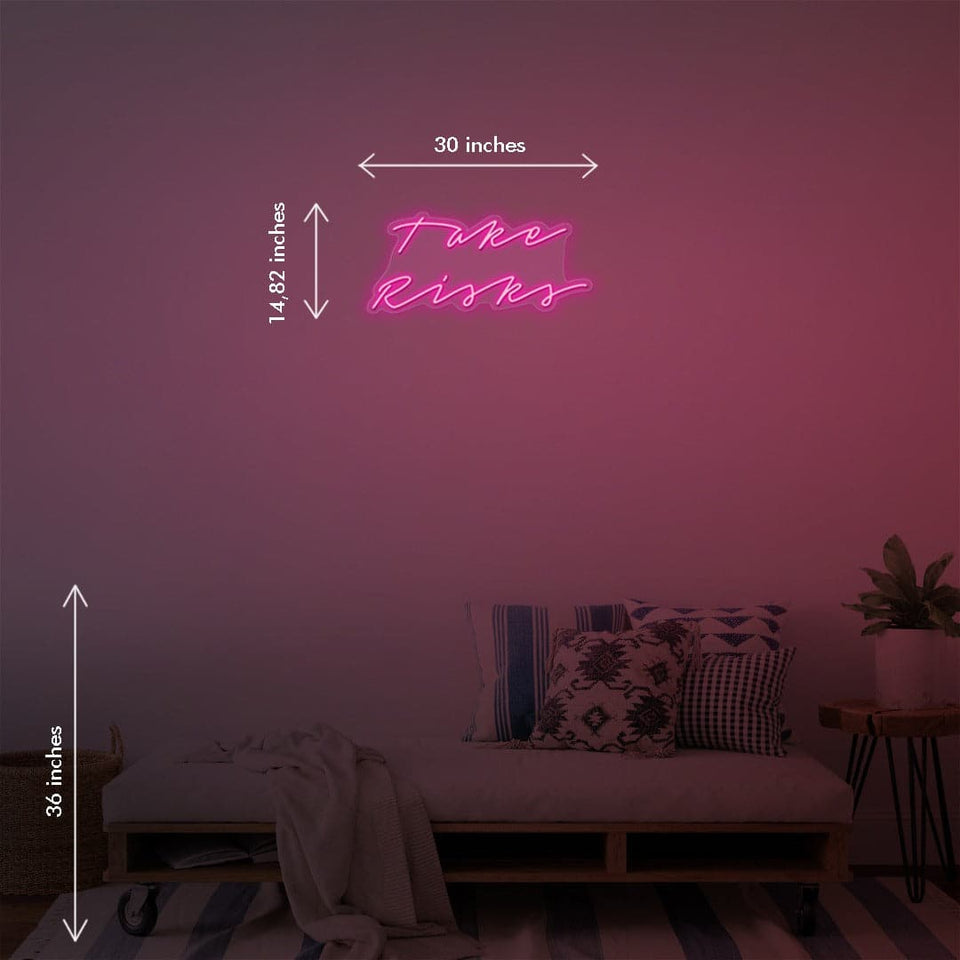 'Take Risks' is a 30 inch LED Neon Sign by Katie Zamprioli