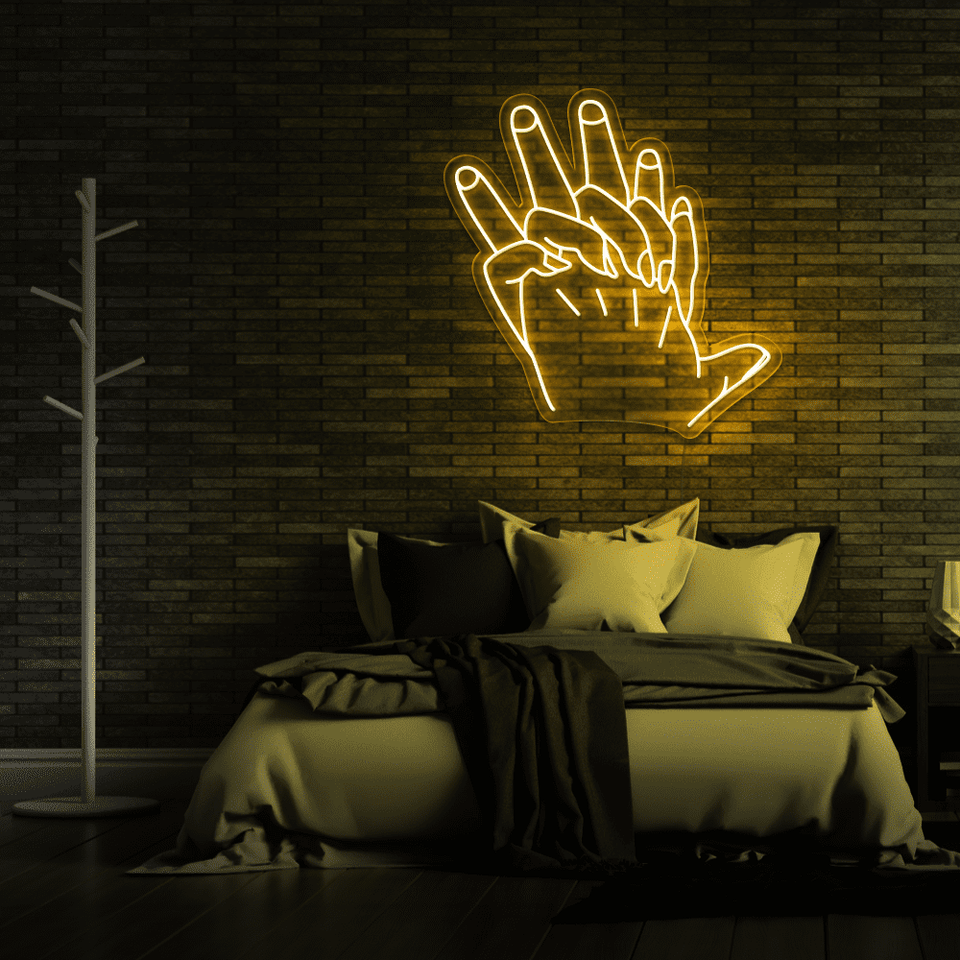 Holding Hands LED neon sign in golden yellow color by Neon Marvels