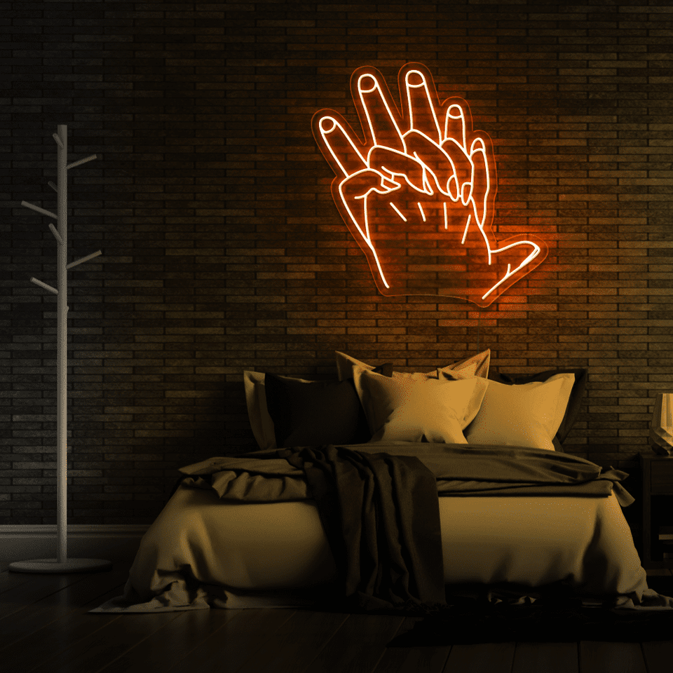 Holding Hands LED neon sign in orange color by Neon Marvels